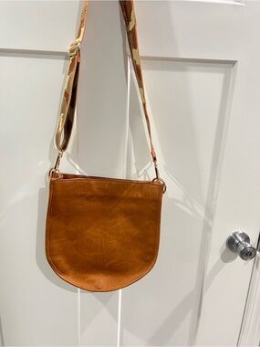 Ahdorned Leather-Textured Tan Crossbody Bag with Patterned Strap